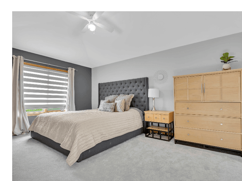 Primary suite with upholstered headboard
